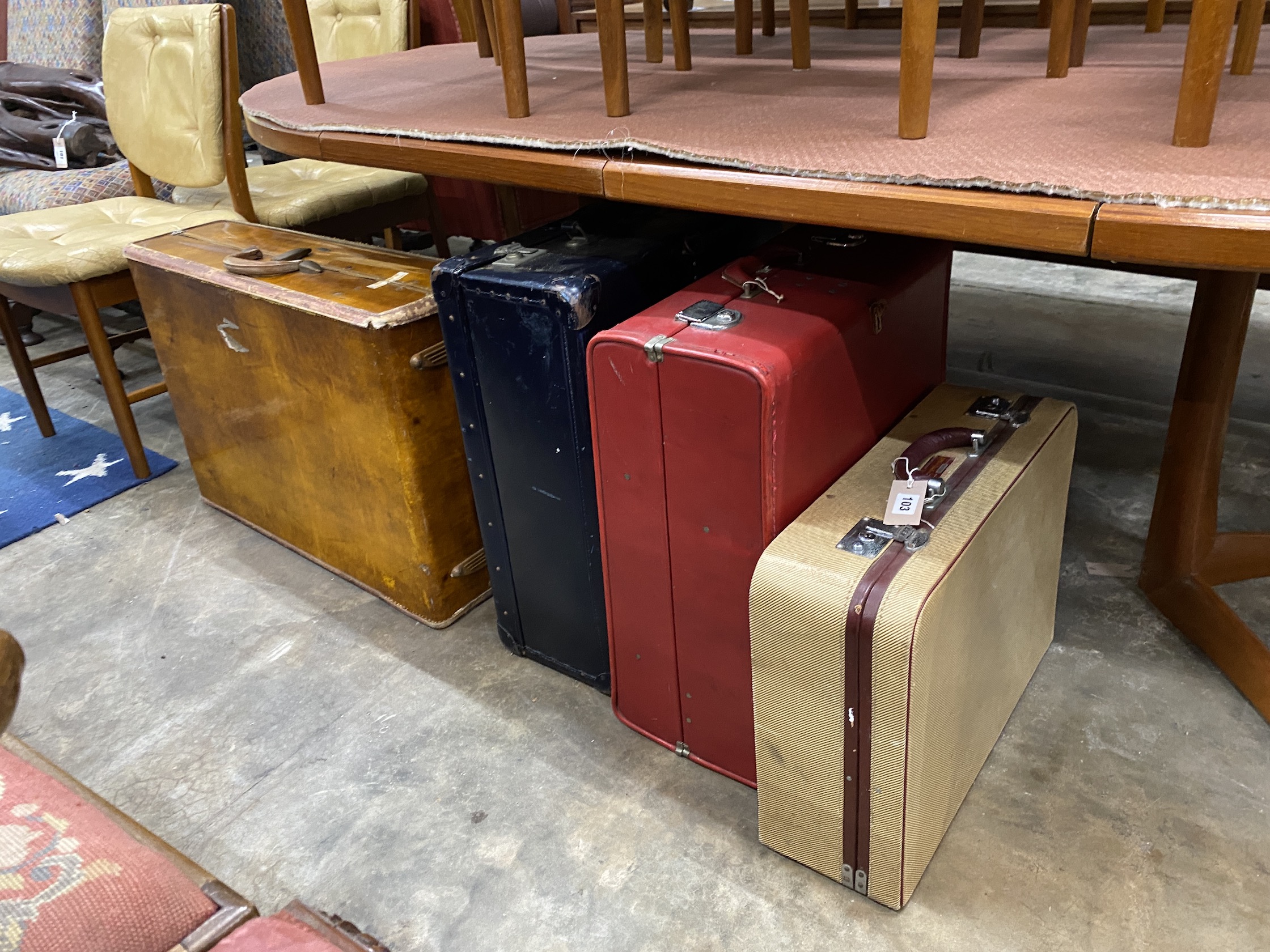 Four vintage suitcases, largest 74 x 51cm